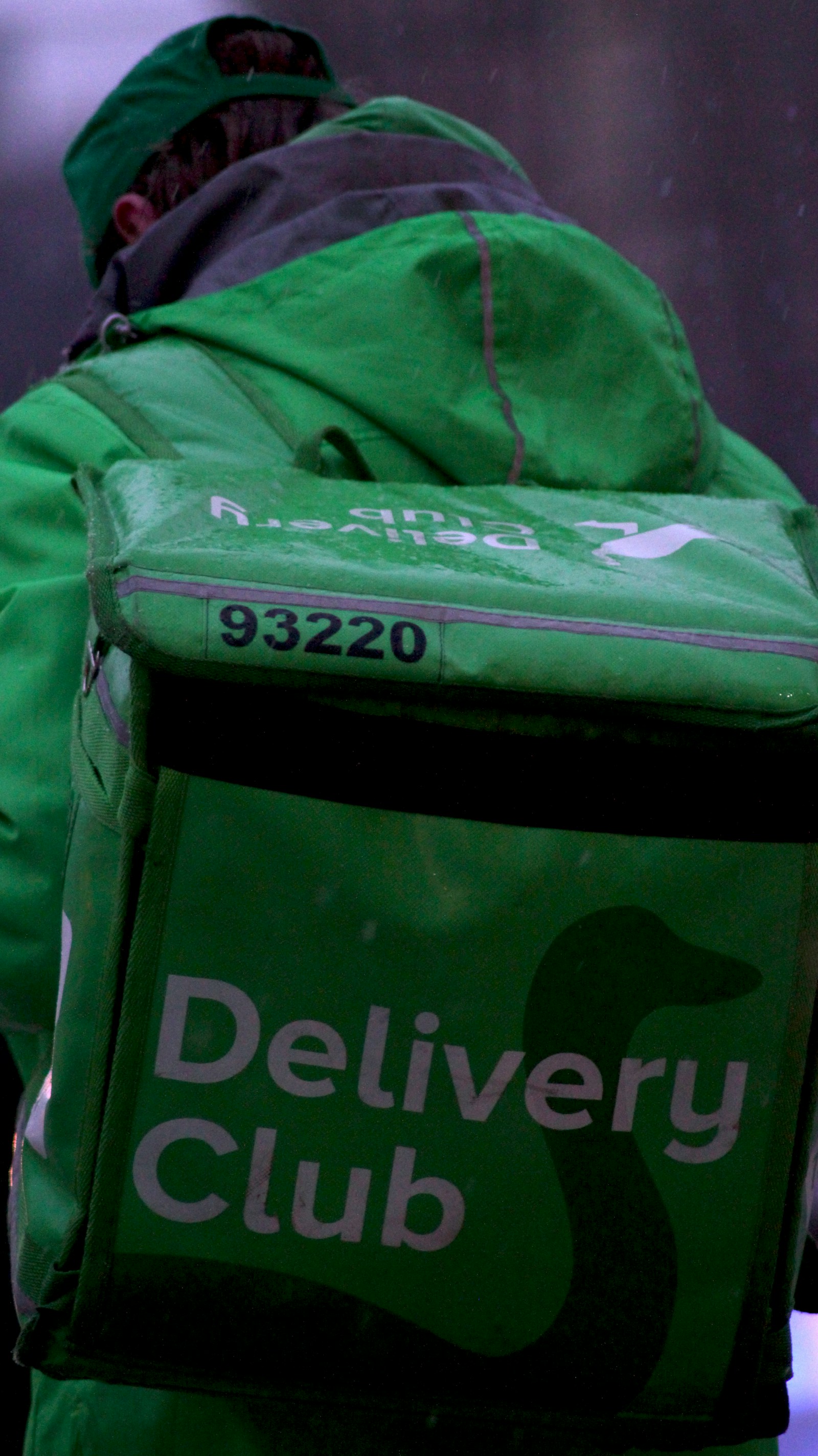 SureRide courier collecting a parcel from a customer's door